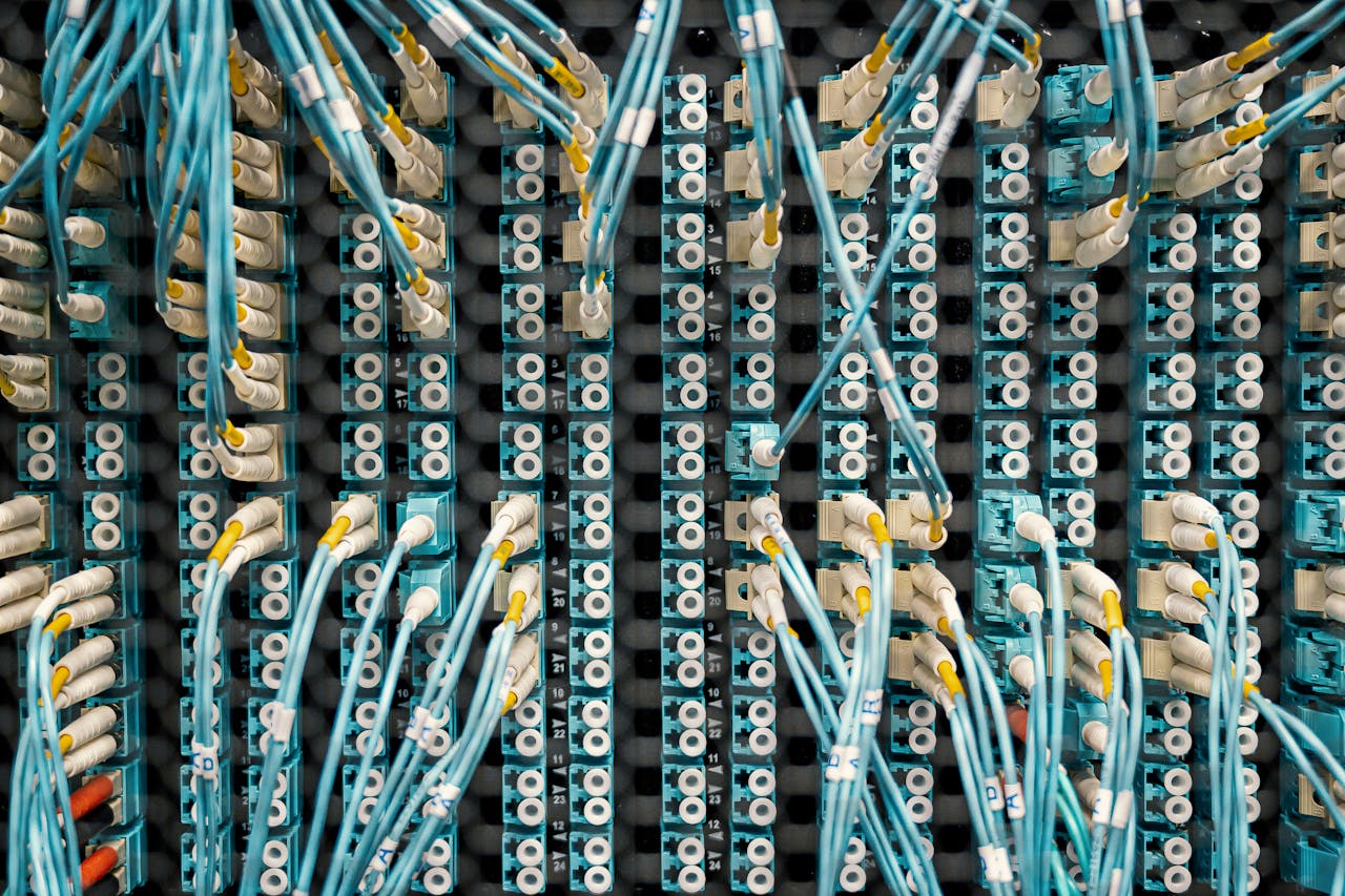 contact-img Top view of fiber optic cables connected to ports in modern data server